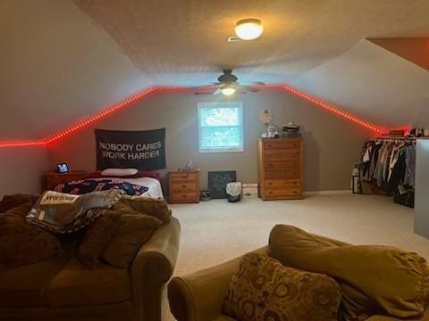 bedroom featuring vaulted ceiling, carpet flooring, and a ceiling fan