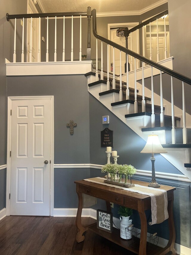 stairs with baseboards and wood finished floors