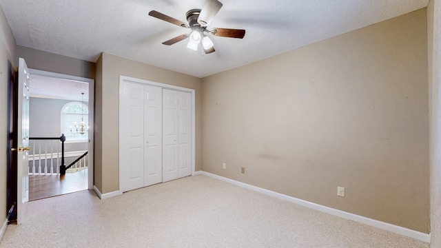 830 Motlow College Rd, Normandy, TN 37360 - unfurnished bedroom featuring light colored carpet, a closet, ceiling fan, and a textured ceiling