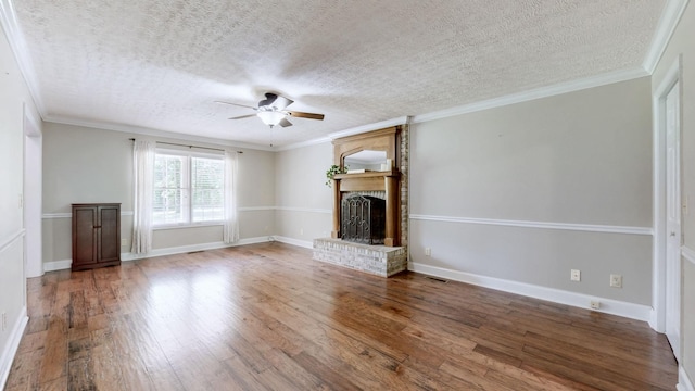 830 Motlow College Rd, Normandy, TN 37360 - unfurnished living room featuring a ceiling fan, hardwood / wood-style flooring, a textured ceiling, a fireplace, and crown molding