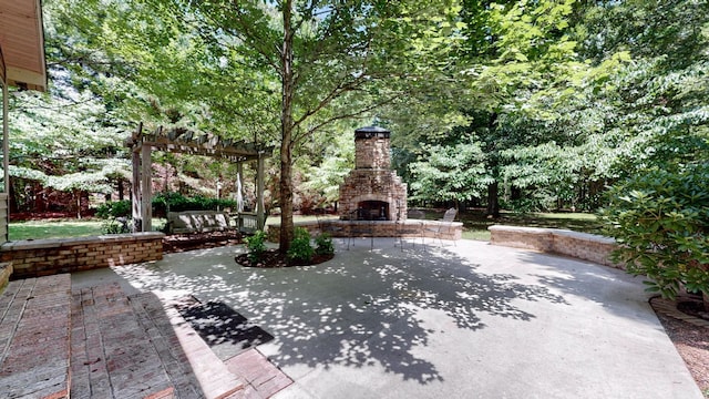 830 Motlow College Rd, Normandy, TN 37360 - view of patio featuring an outdoor stone fireplace and a pergola