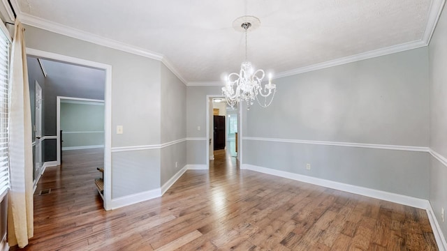 830 Motlow College Rd, Normandy, TN 37360 - empty room featuring a chandelier, wood finished floors, and crown molding