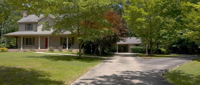 830 Motlow College Rd, Normandy, TN 37360 - view of front of property with a chimney, asphalt driveway, a front yard, and covered porch