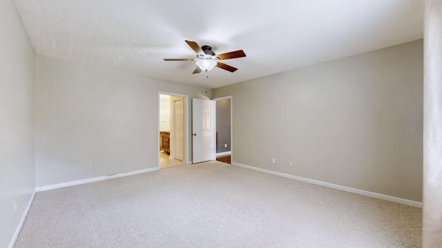 830 Motlow College Rd, Normandy, TN 37360 - unfurnished bedroom featuring light carpet, ensuite bath, and ceiling fan