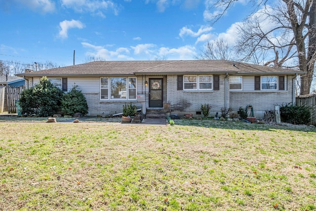 ranch-style home featuring a front yard, brick siding, and fence