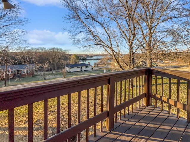 wooden terrace with a water view