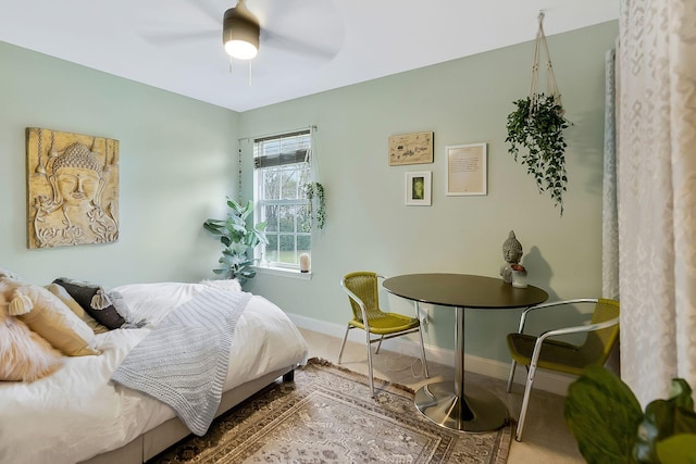 bedroom featuring ceiling fan and baseboards