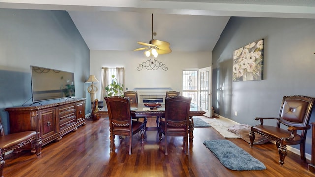 dining area featuring a ceiling fan, high vaulted ceiling, baseboards, and wood finished floors