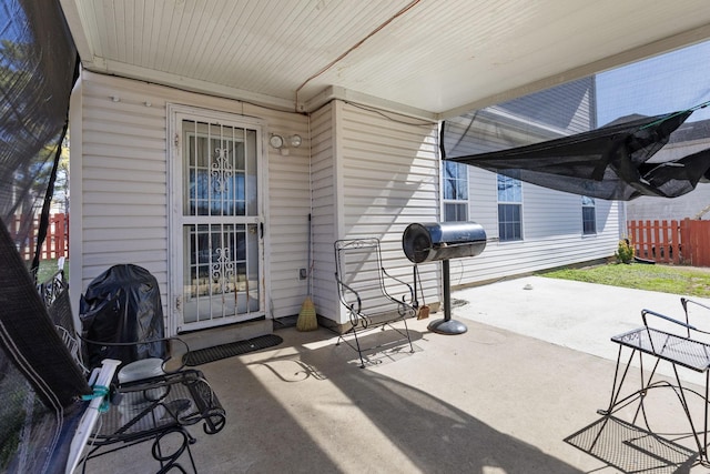 view of patio with fence and area for grilling