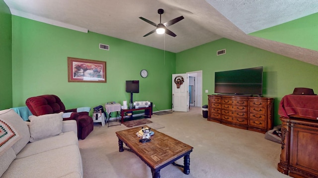 living room featuring carpet, ceiling fan, visible vents, and vaulted ceiling