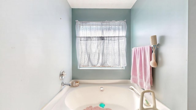 bathroom featuring a bath