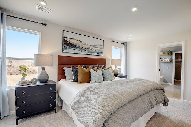 bedroom featuring light carpet, multiple windows, visible vents, and recessed lighting