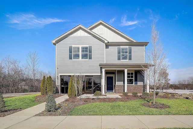 craftsman house with brick siding, board and batten siding, and a front yard