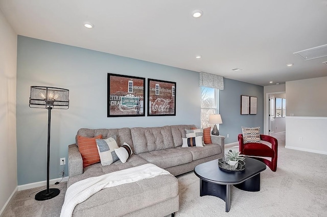 carpeted living room with recessed lighting, attic access, and baseboards