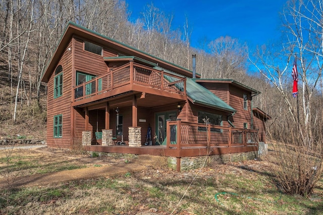 view of front of home featuring a wooden deck