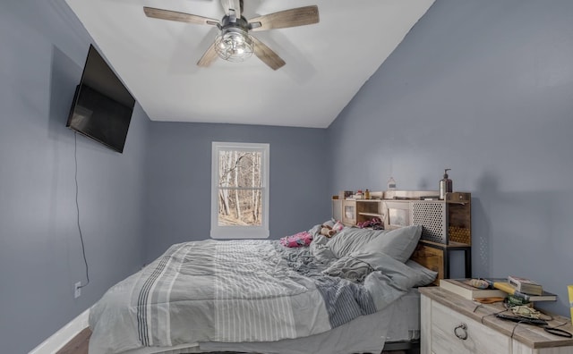 bedroom with vaulted ceiling and a ceiling fan