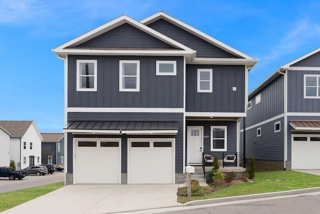 view of front of house featuring concrete driveway, an attached garage, a standing seam roof, a porch, and board and batten siding