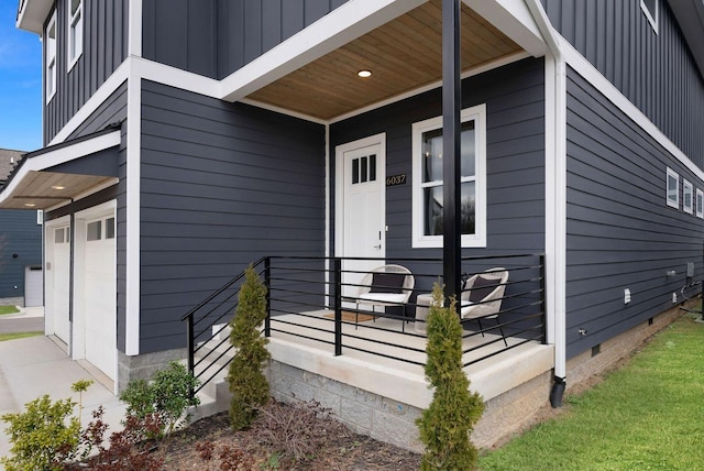 property entrance featuring board and batten siding and crawl space