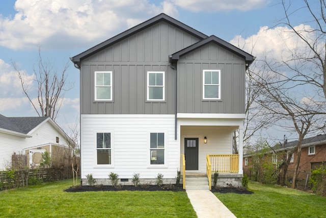 view of front of property with fence, a front lawn, a porch, and board and batten siding