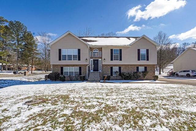 raised ranch with brick siding