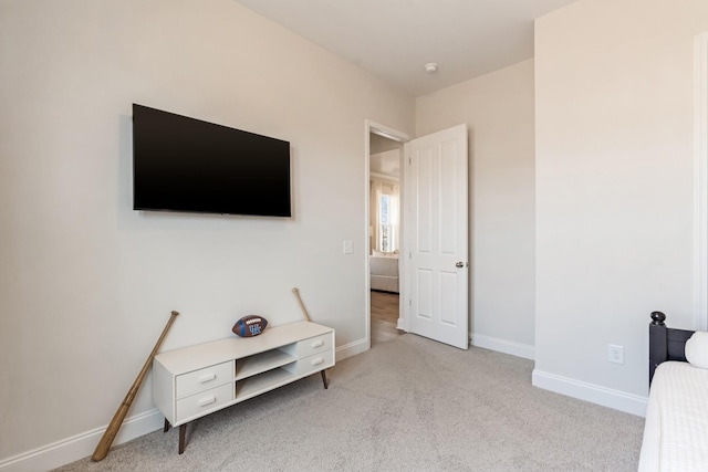 bedroom featuring carpet floors and baseboards