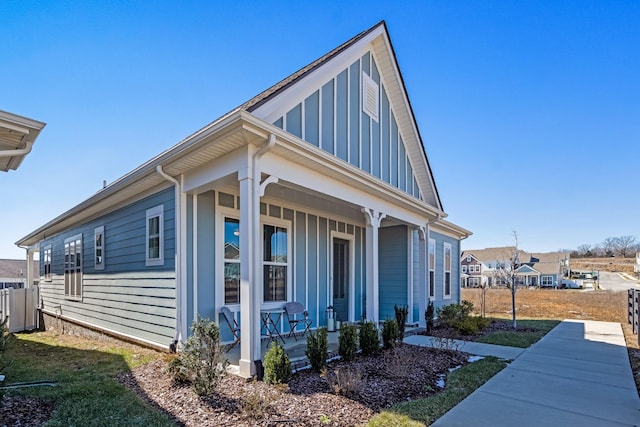 view of property exterior featuring board and batten siding and a porch