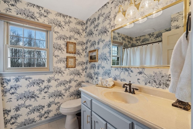 full bathroom featuring wallpapered walls, a shower with shower curtain, toilet, tile patterned floors, and vanity