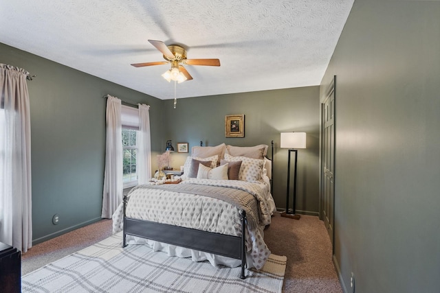 bedroom with a textured ceiling, ceiling fan, carpet flooring, and baseboards