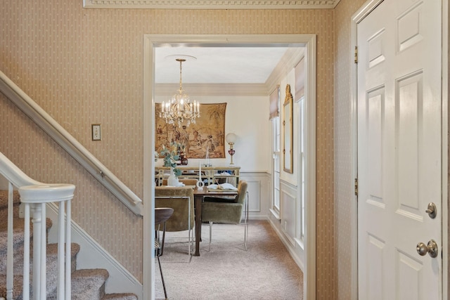 interior space with wallpapered walls, carpet, stairs, and wainscoting