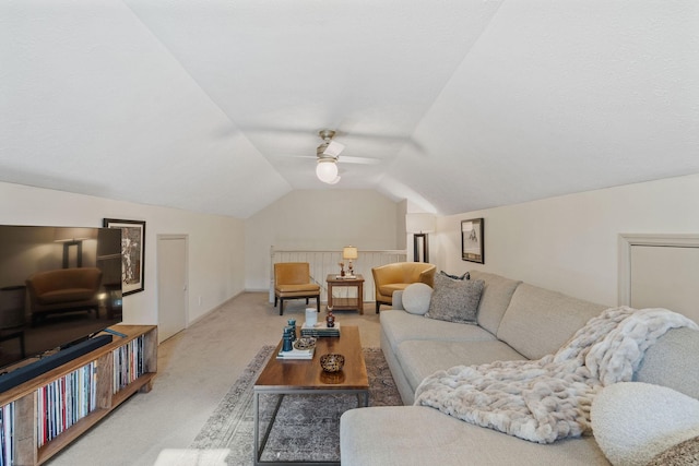 living area with a ceiling fan, vaulted ceiling, and carpet flooring