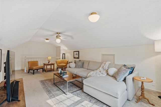 living area with lofted ceiling, carpet, a ceiling fan, and baseboards