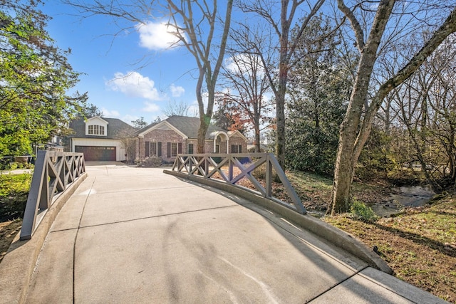 exterior space with concrete driveway