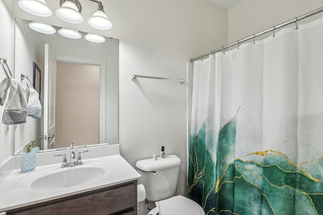 full bathroom with toilet, a shower with curtain, and vanity