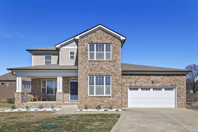 view of front facade with covered porch, concrete driveway, brick siding, and a garage