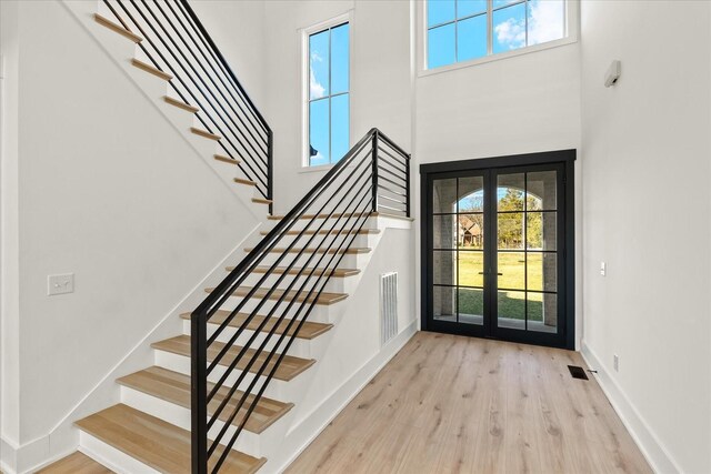 105 Stillwind Ct, Nolensville, TN 37135 - foyer entrance with french doors, wood finished floors, and stairs