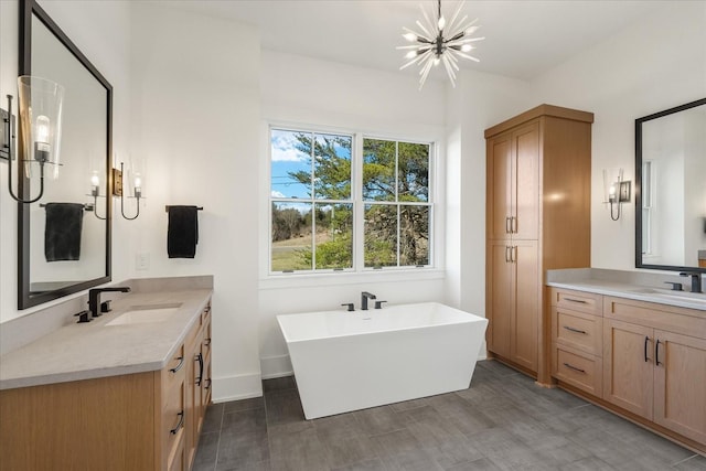 105 Stillwind Ct, Nolensville, TN 37135 - full bath featuring a soaking tub, two vanities, a sink, and a notable chandelier