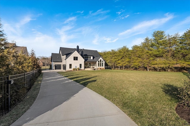 105 Stillwind Ct, Nolensville, TN 37135 - view of front of house featuring an attached garage, driveway, a front yard, and fence