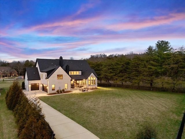 105 Stillwind Ct, Nolensville, TN 37135 - rear view of property with a yard, a chimney, fence, a patio, and concrete driveway