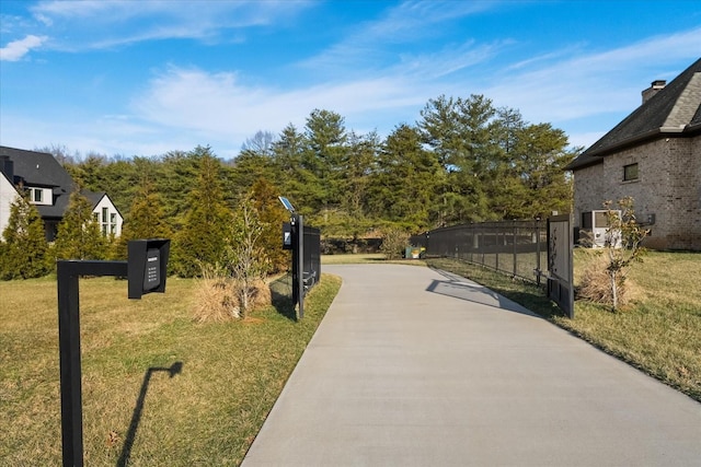 105 Stillwind Ct, Nolensville, TN 37135 - surrounding community featuring concrete driveway, a yard, and a gate