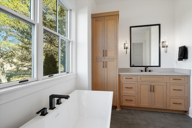 105 Stillwind Ct, Nolensville, TN 37135 - bathroom featuring a soaking tub, vanity, and tile patterned flooring