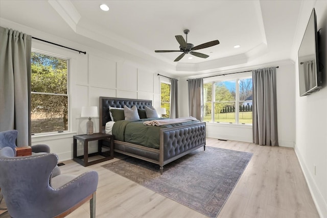 105 Stillwind Ct, Nolensville, TN 37135 - bedroom with a tray ceiling, recessed lighting, multiple windows, and light wood-style flooring