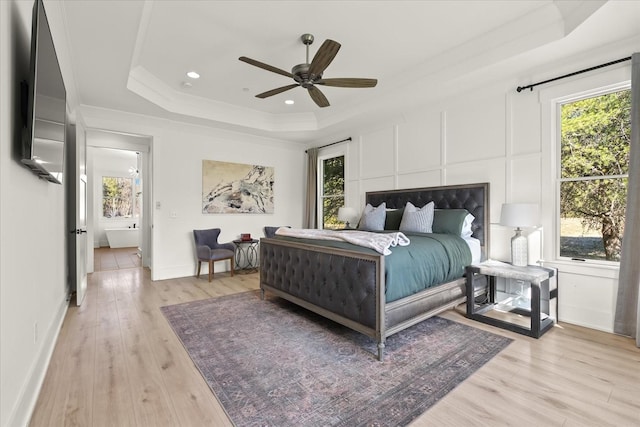 105 Stillwind Ct, Nolensville, TN 37135 - bedroom featuring a raised ceiling, light wood finished floors, and multiple windows