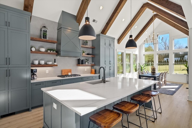 105 Stillwind Ct, Nolensville, TN 37135 - kitchen featuring beamed ceiling, open shelves, stainless steel gas cooktop, a sink, and premium range hood