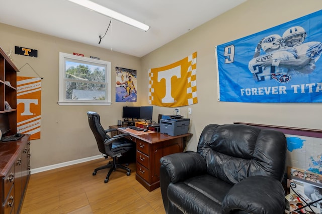 office space featuring light wood-style flooring and baseboards