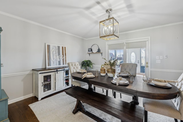 dining room with dark wood-style floors, crown molding, and baseboards