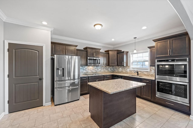 kitchen featuring dark brown cabinetry, tasteful backsplash, appliances with stainless steel finishes, and a sink