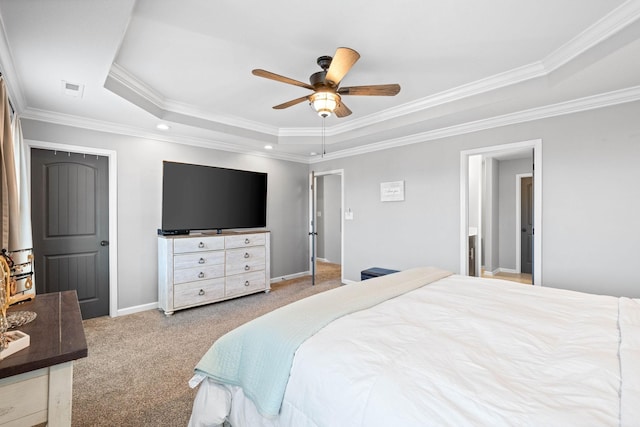 bedroom with baseboards, visible vents, a raised ceiling, crown molding, and carpet flooring