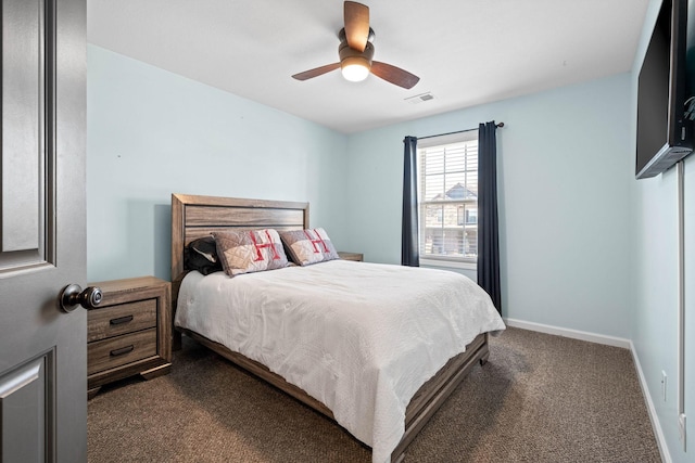 bedroom featuring ceiling fan, visible vents, baseboards, and dark colored carpet