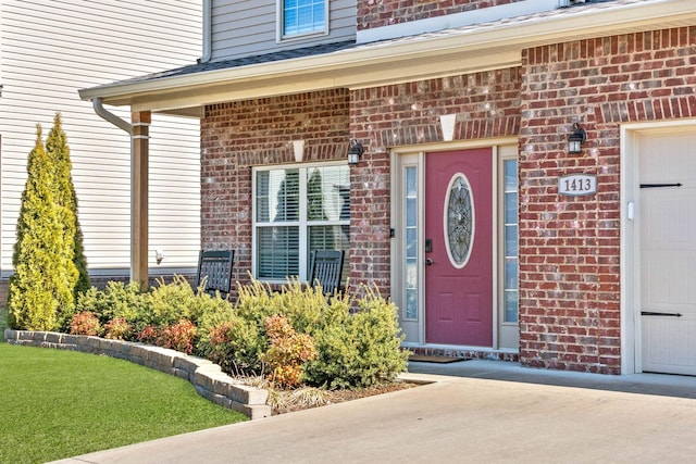 property entrance with brick siding