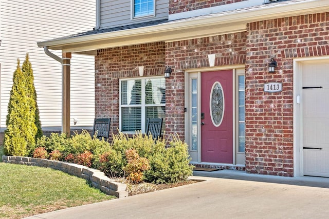 entrance to property with brick siding